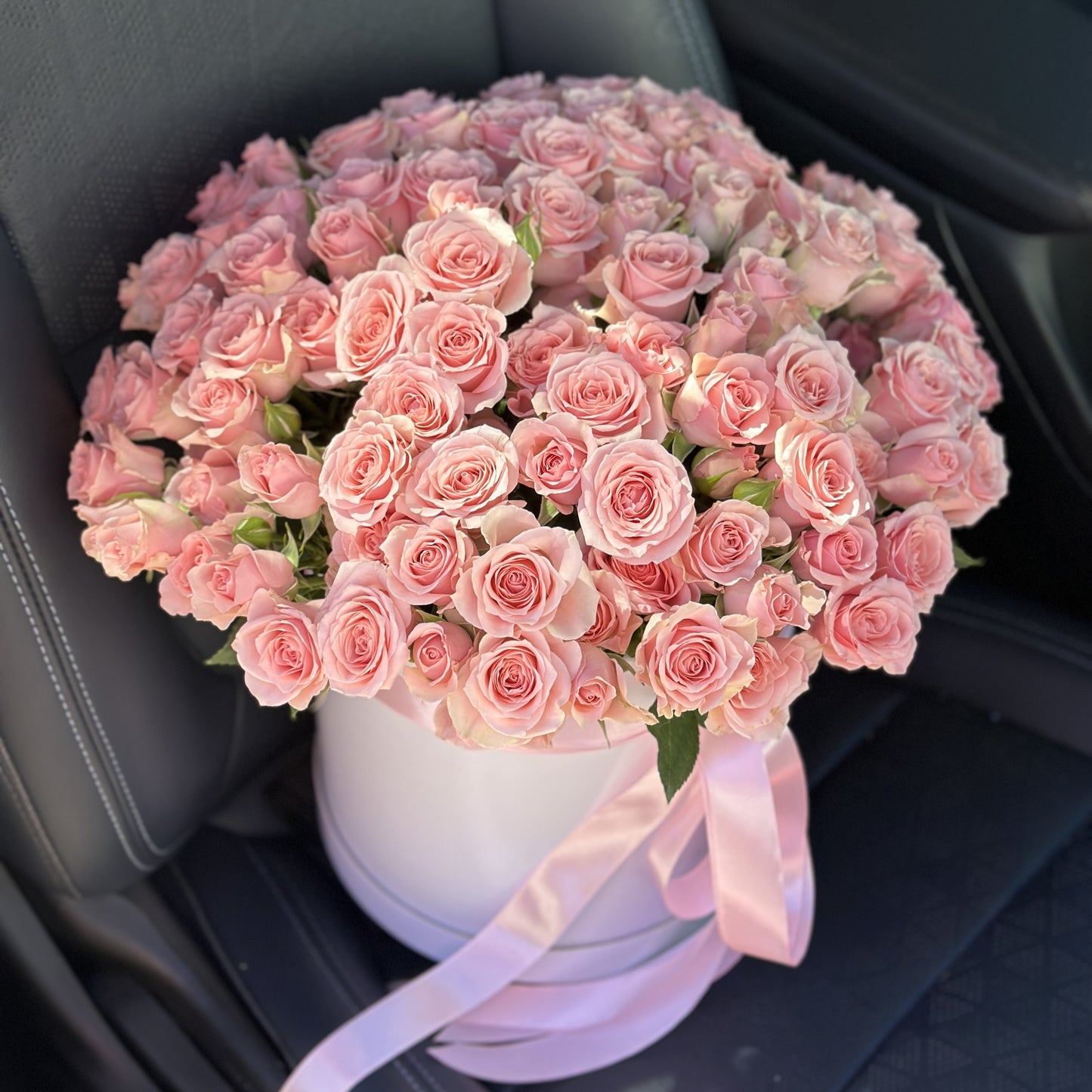 # 62 Pink Spray Roses in round Box