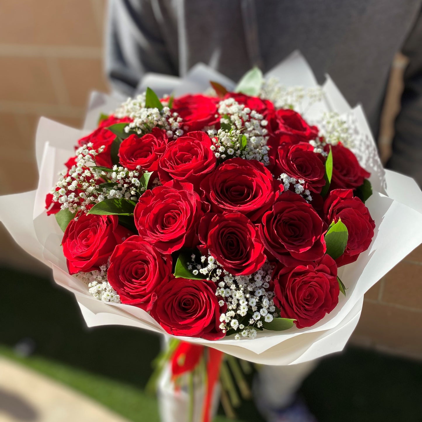 # 22 Red Roses with Baby Breath, Bouquet.