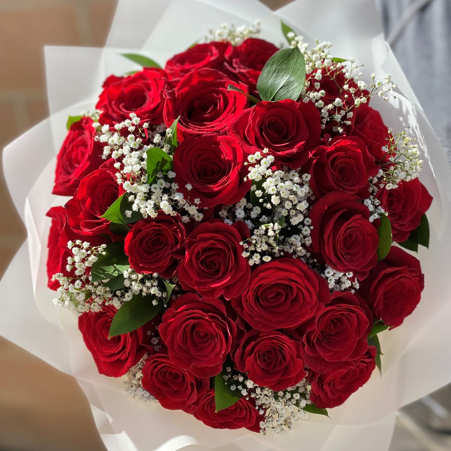 # 22 Red Roses with Baby Breath, Bouquet.