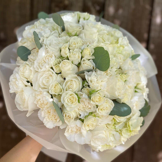 # 12 Bouquet of mixed white flowers.