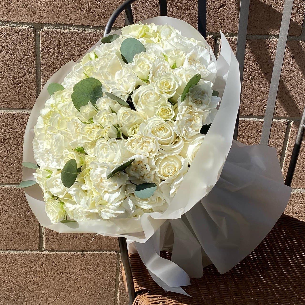 # 12 Bouquet of mixed white flowers.